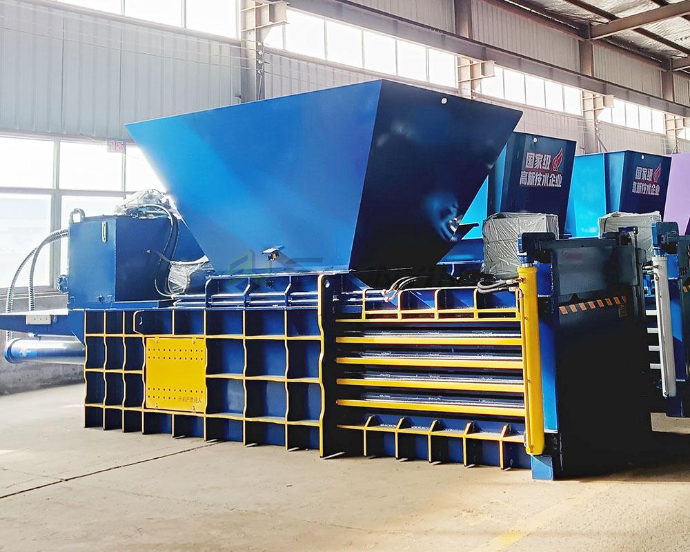 Horizontal baler optimized for compacting plastic packaging waste.